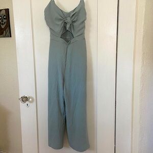 Size small pastel blue romper, tie front, side zipper, adjustable straps